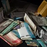 A variety of international banknotes scattered in a pile, highlighting global currency exchange.