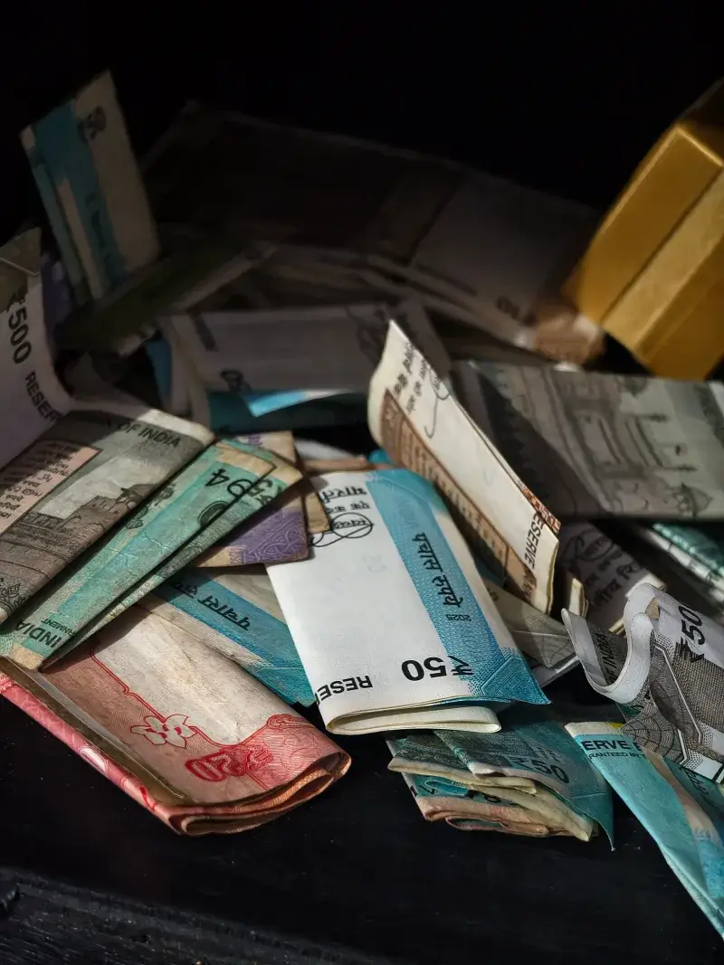 A variety of international banknotes scattered in a pile, highlighting global currency exchange.