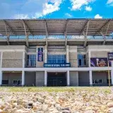 Front view of the Estadio de Béisbol 18 de Junio, highlighting the stadium entrances in Montería, Colombia.
