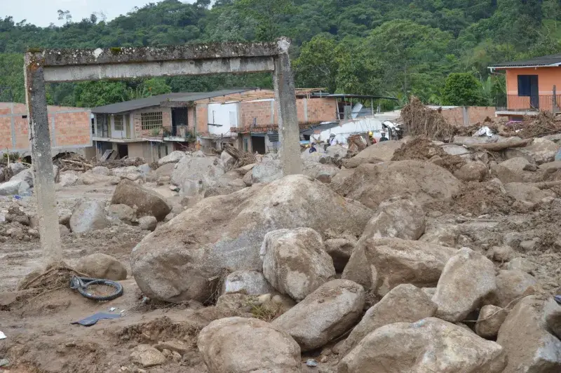 Destruction in Mocoa, Colombia, following a massive landslide, showcasing devastated buildings and debris.