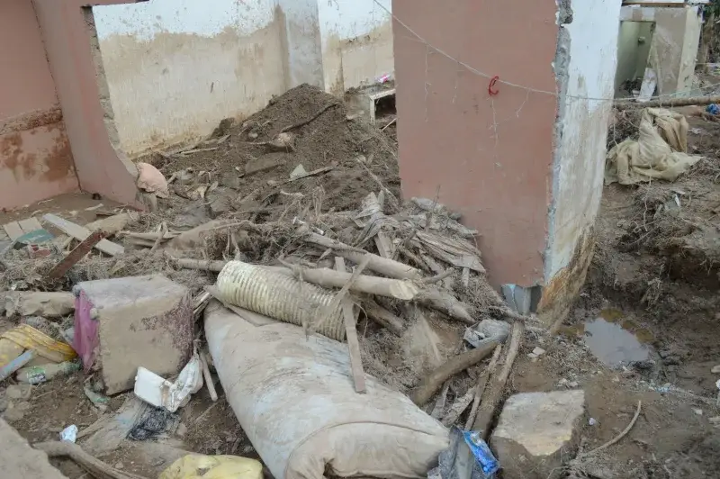 Interior of a building in Mocoa, Colombia, showing debris after a natural disaster.
