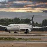 Aeromexico Boeing 787 Dreamliner on runway in Madrid, showcasing travel and aviation at sunset.