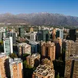 Aerial view of Santiago de Chile skyline with the Andes Mountains in the background.