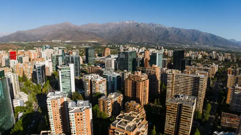 Aerial view of Santiago de Chile skyline with the Andes Mountains in the background.