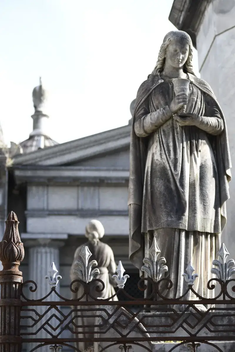 Historical statues in Cementerio de la Recoleta, Buenos Aires, Argentina, under daylight.
