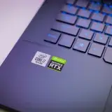 Laptop keyboard with Intel Core i7 and NVIDIA GeForce RTX stickers, symbolizing high-performance computing power.