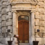 Elegant facade of Deutsche Orientbank in Istanbul with wooden doors.