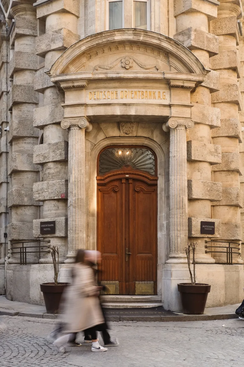 Elegant facade of Deutsche Orientbank in Istanbul with wooden doors.