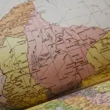Detailed vintage map showing geographic regions in an old atlas book, highlighting Mérida, Venezuela.