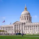 San Francisco City Hall with a classic dome under clear blue skies.