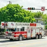 City of Miami fire-rescue truck with dive team module on a sunny street.