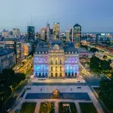 Stunning aerial view of Buenos Aires cityscape with illuminated palace at night.