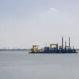 Oil platform in the sea under clear skies, showcasing industrial seascape.