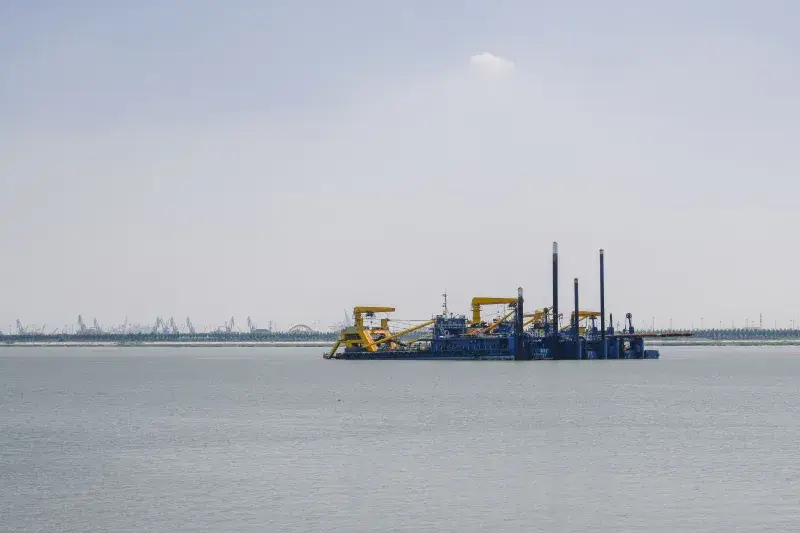 Oil platform in the sea under clear skies, showcasing industrial seascape.