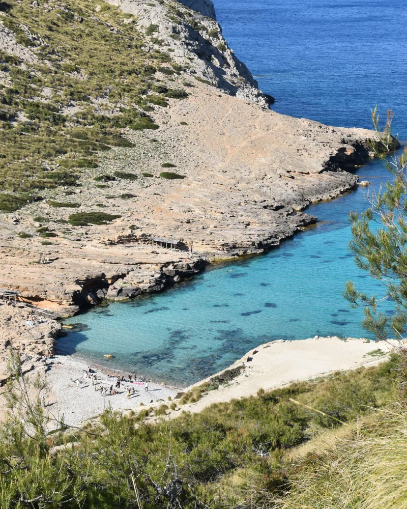 Stunning aerial view of Cala Figuera's turquoise waters and rocky coast in Mallorca, Spain.
