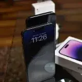 Stylish setup of iPhone 14 Pro showcasing dynamic island feature with accessories.