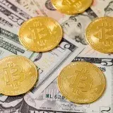 Golden Bitcoin coins scattered over US dollar bills, symbolizing modern digital currency.