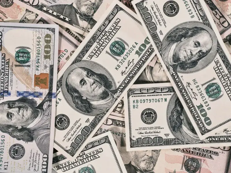 Detailed close-up of US dollar bills highlighting wealth and finance concepts.