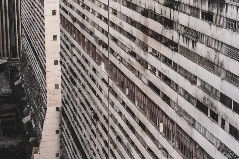 A detailed aerial view of a high-rise apartment building facade in Caracas, Venezuela, showcasing its urban architecture.