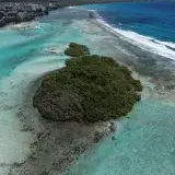 A serene aerial view capturing the coast and turquoise waters near Boca Chica, Dominican Republic.