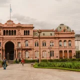 Front view of the historic Casa Rosada in Buenos Aires, Argentina with people in foreground.