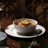 Delicious Mexican Sopa Azteca served in an authentic setting with a warm, inviting atmosphere.