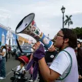 A passionate speaker using a megaphone during a street protest in Trujillo, Perú.