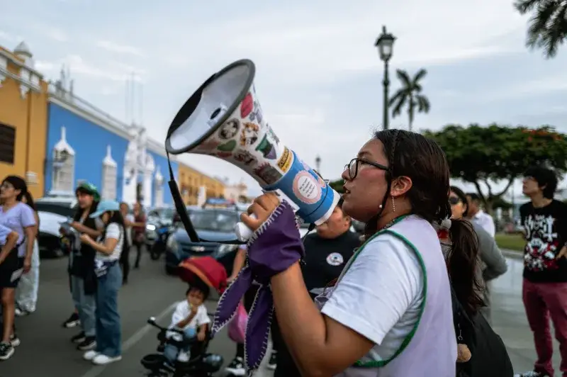A passionate speaker using a megaphone during a street protest in Trujillo, Perú.