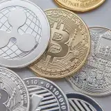 High-resolution vertical shot of various cryptocurrency coins, emphasizing Bitcoin, Ethereum, and Ripple.