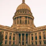 The grand dome and architecture of Wisconsin State Capitol in Madison at dusk.