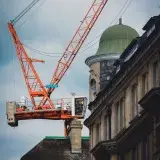 A vibrant urban construction site with a prominent crane in Oxford, UK.