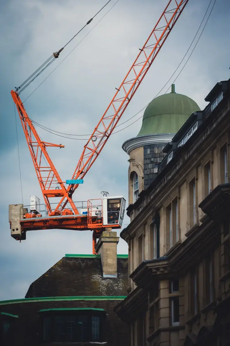 A vibrant urban construction site with a prominent crane in Oxford, UK.