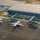 Aerial view of Abeid Amani Karume International Airport in Zanzibar, showing parked airplanes and terminal.