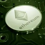 Close-up of an Ethereum coin placed on a circuit board, symbolizing digital currency technology.