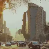 Warm sunset view in Ciudad de México featuring busy streets and tall architecture with a warm urban glow.