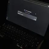 A dark-themed laptop screen displaying the DeepSeek AI interface, highlighting modern technology.