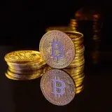Close-up image of Bitcoin stacks on a reflective surface symbolizing digital currency and wealth.