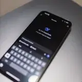 Smartphone with DeepSeek AI interface on a laptop keyboard, showcasing technology and innovation.