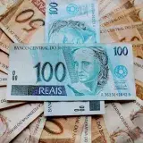 Close-up of Brazilian Real banknotes featuring different denominations and intricate designs.