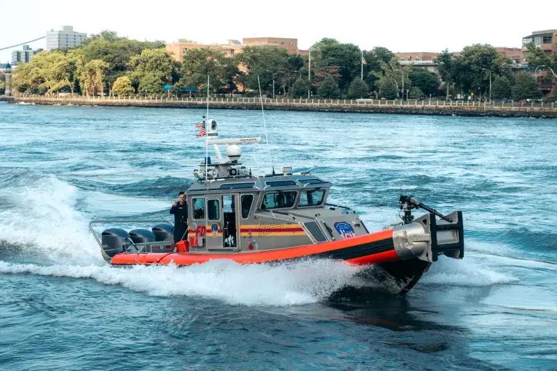A FDNY fireboat navigates the waters of New York City for emergency services and maritime safety.