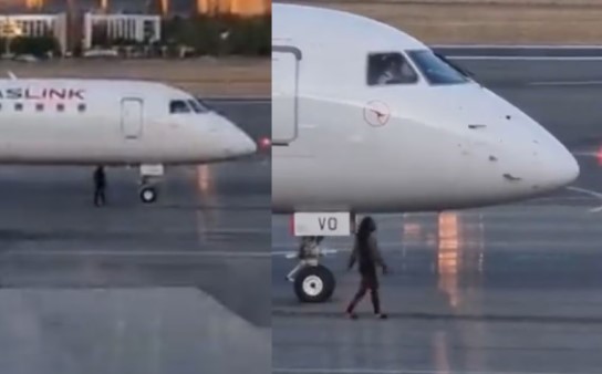 VIDEO: Mujer en chanclas irrumpe en la pista de un aeropuerto e intenta abordar el avión que perdió