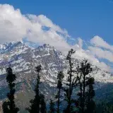 Captivating view of the snow-covered Himalayan peaks at Salud Dugra, Uttarakhand, India.