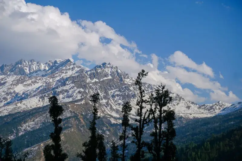 Captivating view of the snow-covered Himalayan peaks at Salud Dugra, Uttarakhand, India.