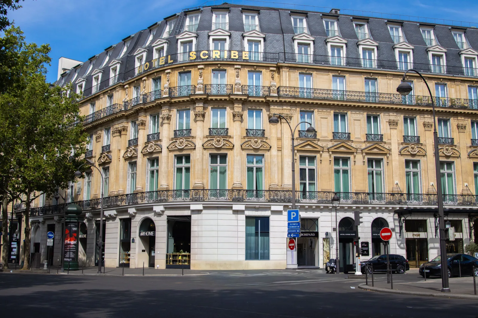 Elegant facade of Hotel Scribe in Paris captured in daylight showcasing classic French architecture.