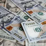 A collection of US dollar bills featuring different denominations, ideal for finance themes.