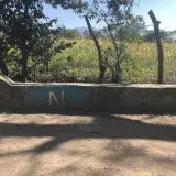 File:N of Nuevas Ideas painted on curb.jpg