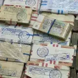 Soviet ruble banknotes wrapped in plastic, showcasing historical currency stacks.