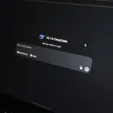 Close-up of an AI chat interface on a laptop screen in a dark setting.