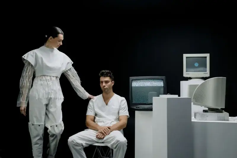 A modern scene with people in futuristic fashion amidst vintage technology.