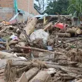 Destruction in Mocoa, Colombia due to natural disaster. Damaged structures and debris.